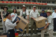 Giving out donations to school