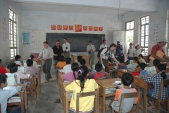 Passing out pencils at school